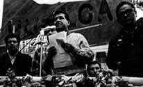 Cesar speaking at a rally
