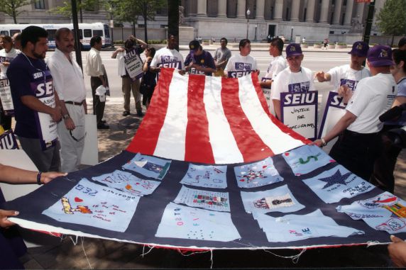 (29795) Participants Hold Flag, Immigration Rights Rally, Washington, D.C., 2002