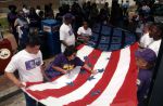 (29797) Participants Decorate Flag, Immigration Rights Rally, Washington, D.C., 2002