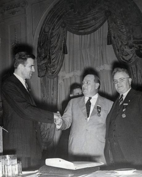 (32281) Arnold Zander shakes hands, 1940 AFSCME convention