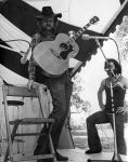 (32387) Utah Phillips Performing Outdoors on Stage, circa 1970s