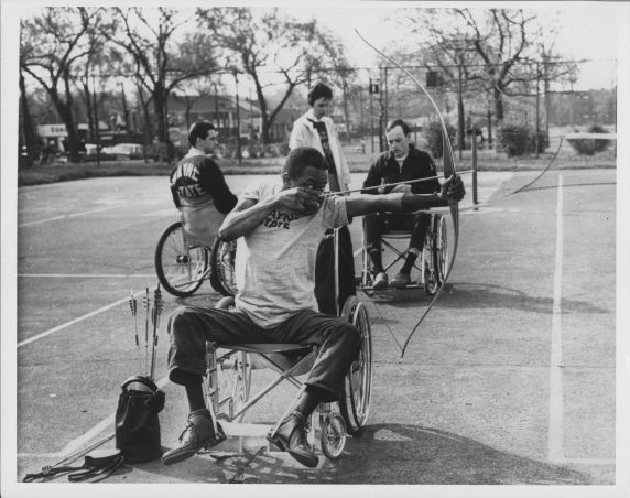 (35993) Archery Warm-up before Michigan Wheelchair Games, 1968