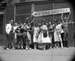 (37313) Student Activities; Students with "We Like Shorts" signs, circa 1950s.