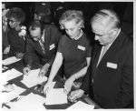 (38428) Dr. Cornelius Golightly, second from left, signs paperwork joining the Detroit School Board