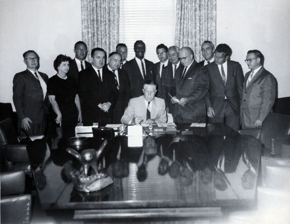 (25543) George Romney signs collective bargaining law