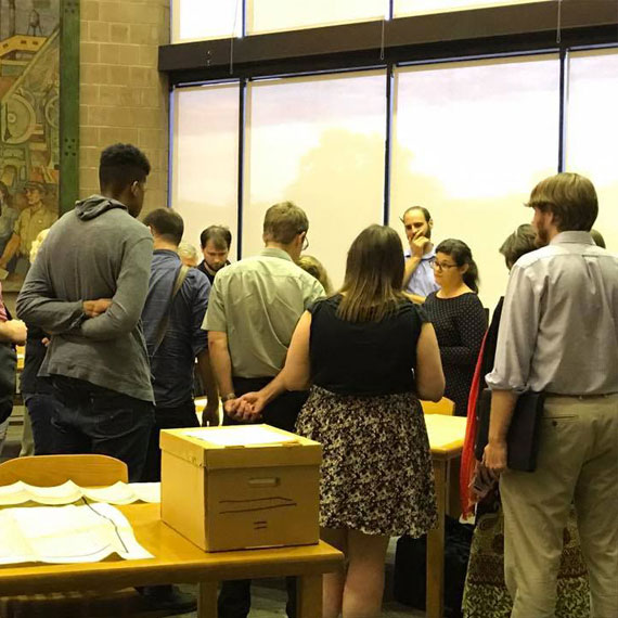 Reuther Library staff member Meghan Courtney discusses the use of primary resources in research to a visiting class